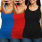 Three women wearing blue, red, and black tank tops 