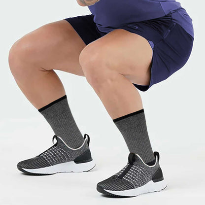 man wearing dr motion compression crew socks during outdoor workout