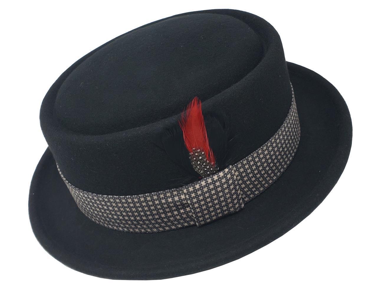 A black flat top Pork Pie fedora hat with a patterned band and a red feather decoration on the side.