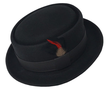 A black flat top Pork Pie fedora hats with a patterned band and a red feather decoration on the side.