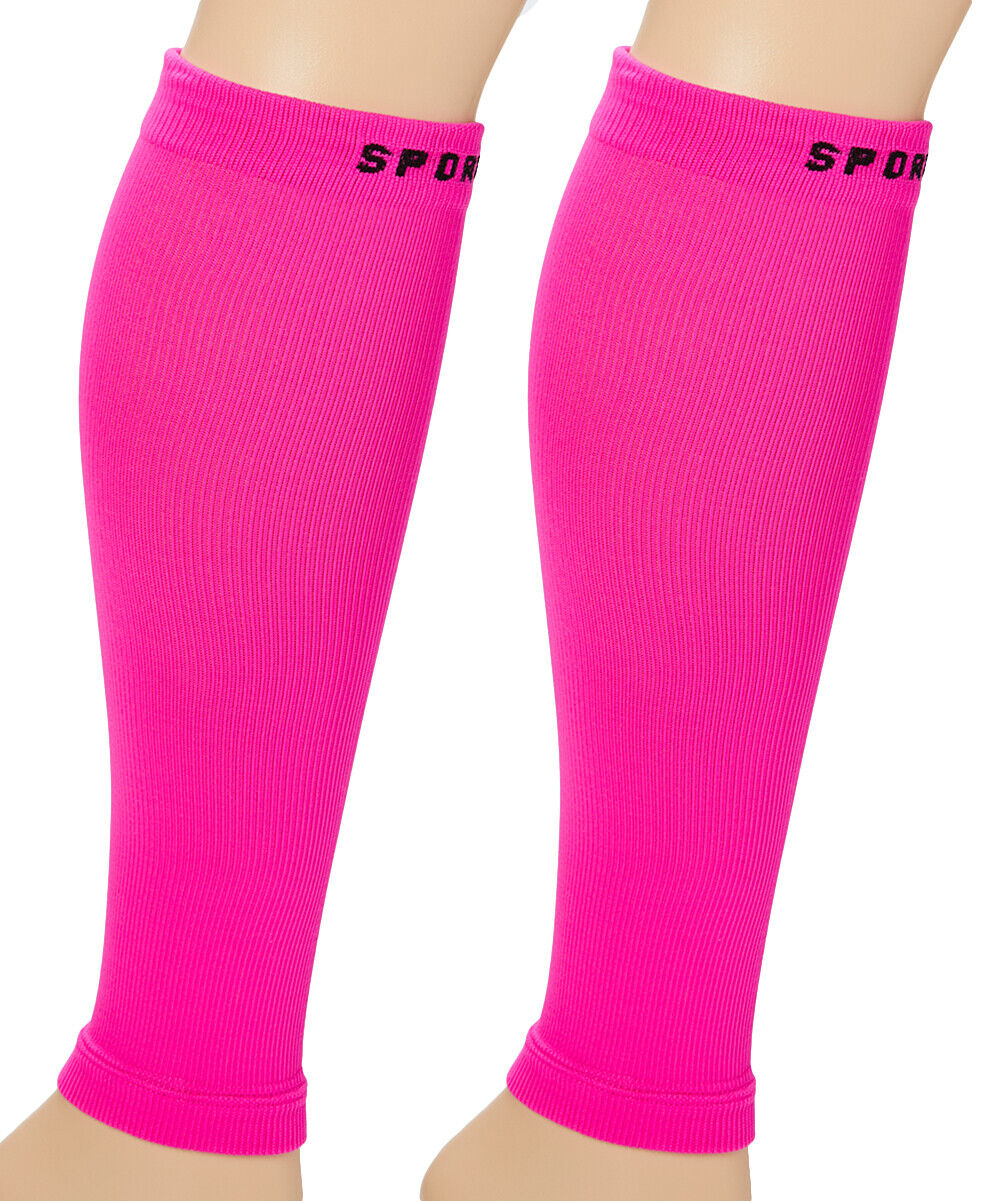 A pair of bright pink compression calf foot socks with 'SPORTX' written on the upper ankle area.